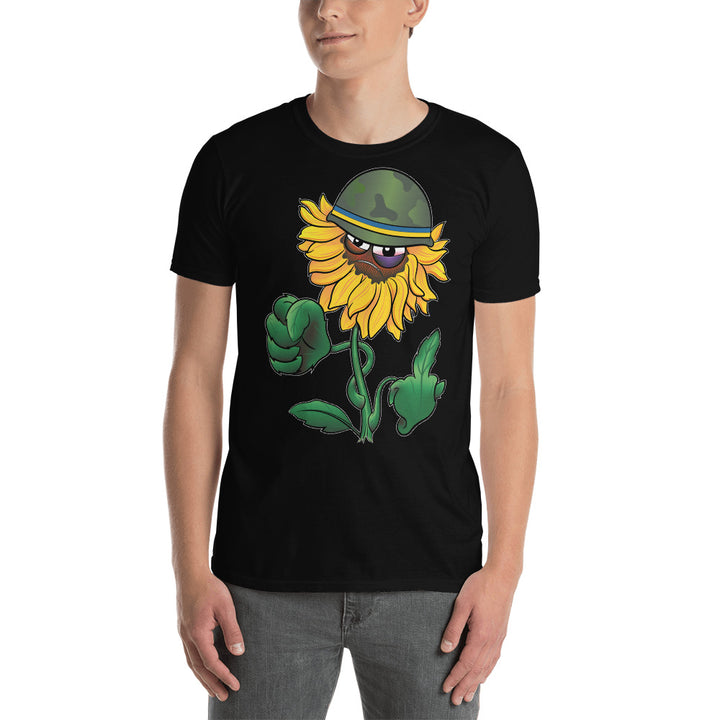 An attractive man wears a black t-shirt with a sunflower wearing an army helmet with a band in the Urkanian flag colors. The sunflower has a face and a black eye with a determined look. 