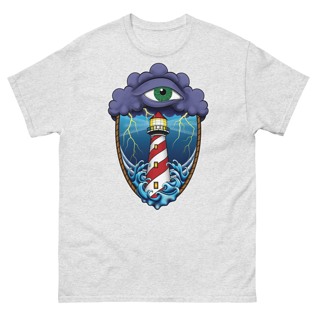 A light grey t-shirt with an old school eye of the storm tattoo design of large dark purple storm clouds at the top of the design with a green eye in the middle of the clouds.  Below the clouds is an oval shape with brown rope. Inside the rope are stormy seas and a lighthouse with lightning striking in the background.  At the bottom of the design, some of the waves are spilling out of the rope barrier. The sky and seas are hues of blue; the lighthouse is white and red striped like a barber pole.