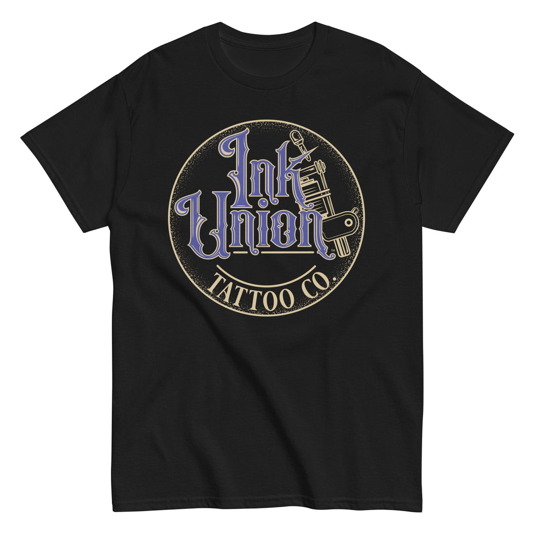 A black t-shirt with a gold circle containing fancy lettering in blue and gold that says Ink Union and a gold tattoo machine peeking out from behind on the right side.  There is a dot work gradient inside the circle, and the words Tattoo Co. in gold are at the bottom of the design.
