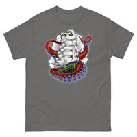 A medium grey t-shirt with an old-school clipper ship tattoo design in green and brown with white sails surrounded by octopus tentacles in shades of red with purple tentacles. Behind the ship are purple-tinged clouds.