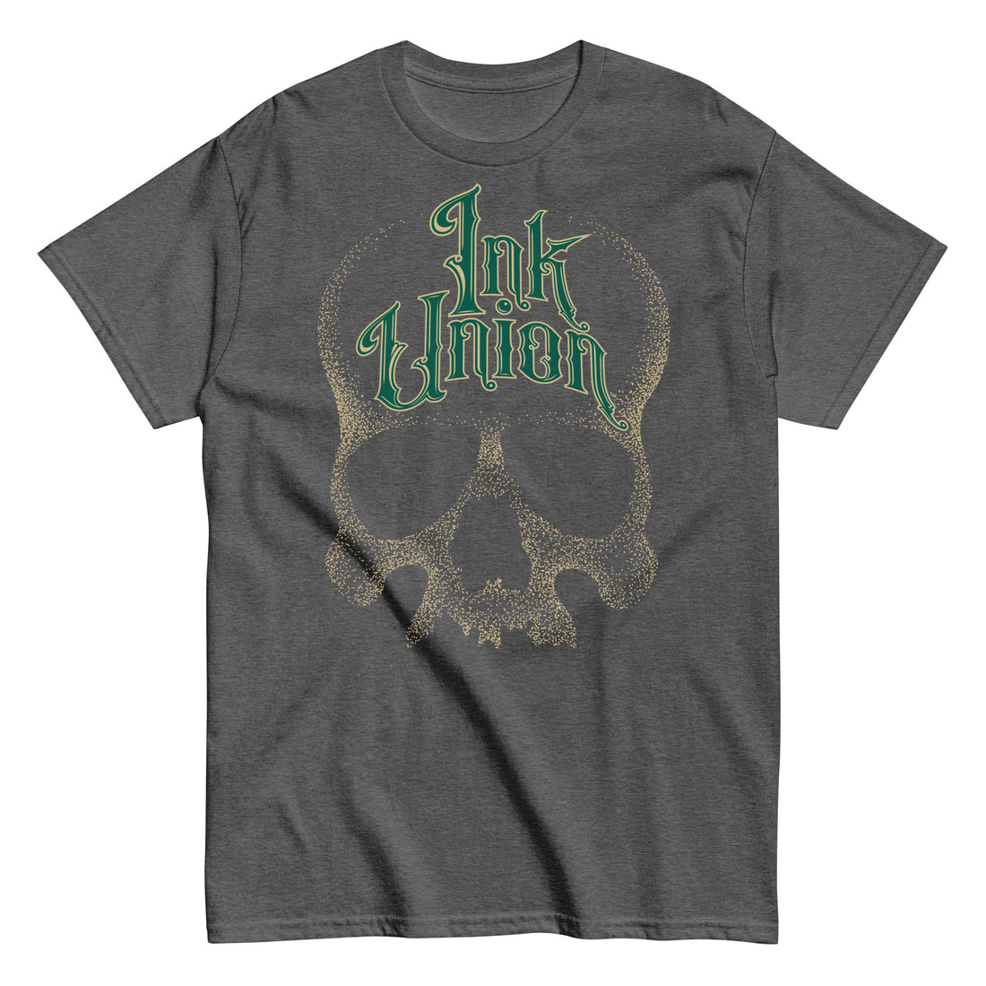 A dark grey t-shirt adorned with a gold dot work human skull  and the words Ink Union in fancy gold and green lettering across the forehead of the skull.