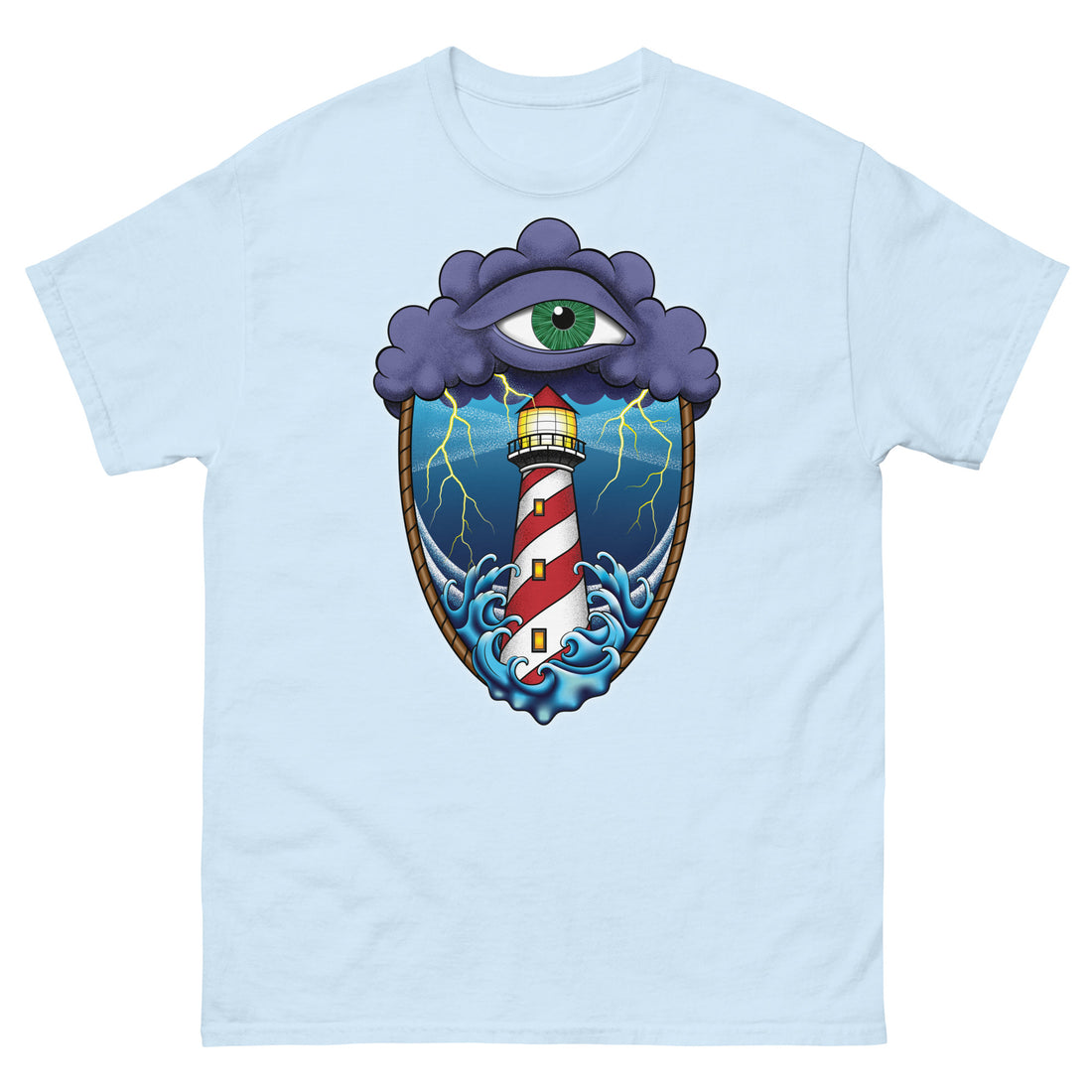 A light blue t-shirt with an old school eye of the storm tattoo design of large dark purple storm clouds at the top of the design with a green eye in the middle of the clouds.  Below the clouds is an oval shape with brown rope. Inside the rope are stormy seas and a lighthouse with lightning striking in the background.  At the bottom of the design, some of the waves are spilling out of the rope barrier. The sky and seas are hues of blue; the lighthouse is white and red striped like a barber pole.