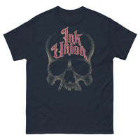 A navy blue t-shirt adorned with a gold dot work human skull  and the words Ink Union in fancy gold and red lettering across the forehead of the skull.
