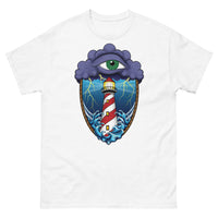 A white t-shirt with an old school eye of the storm tattoo design of large dark purple storm clouds at the top of the design with a green eye in the middle of the clouds.  Below the clouds is an oval shape with brown rope. Inside the rope are stormy seas and a lighthouse with lightning striking in the background.  At the bottom of the design, some of the waves are spilling out of the rope barrier. The sky and seas are hues of blue; the lighthouse is white and red striped like a barber pole.