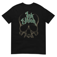 A black t-shirt  adorned with a gold dot work human skull and the words Ink Union in fancy gold and green lettering across the forehead of the skull.