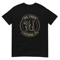 A black t-shirt adorned with the Ink Union Clothing Co gold badge logo containing fancy lettering and dot work gradients.