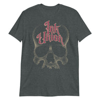 A dark grey t-shirt adorned with a gold dot work human skull and the words Ink Union in fancy gold and red lettering across the forehead of the skull.