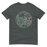 A dark grey t-shirt adorned with the Ink Union Tattoo Co. green and gold with a Silver tattoo machine logo.