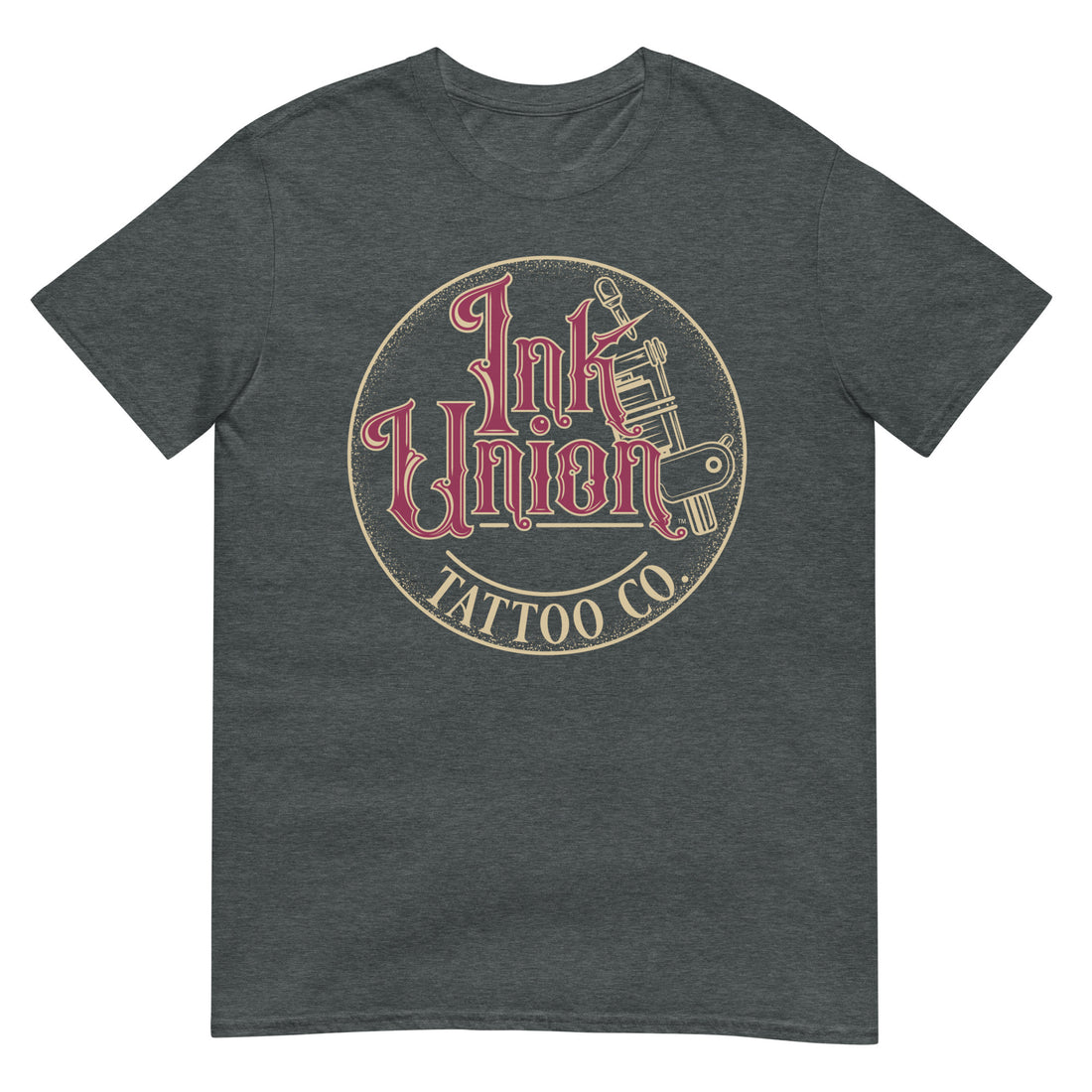 A dark grey t-shirt with a gold circle containing fancy lettering in red and gold that says Ink Union and a gold tattoo machine peeking out from behind on the right side. There is a dot work gradient inside the circle, and the words Tattoo Co. in gold are at the bottom of the design.