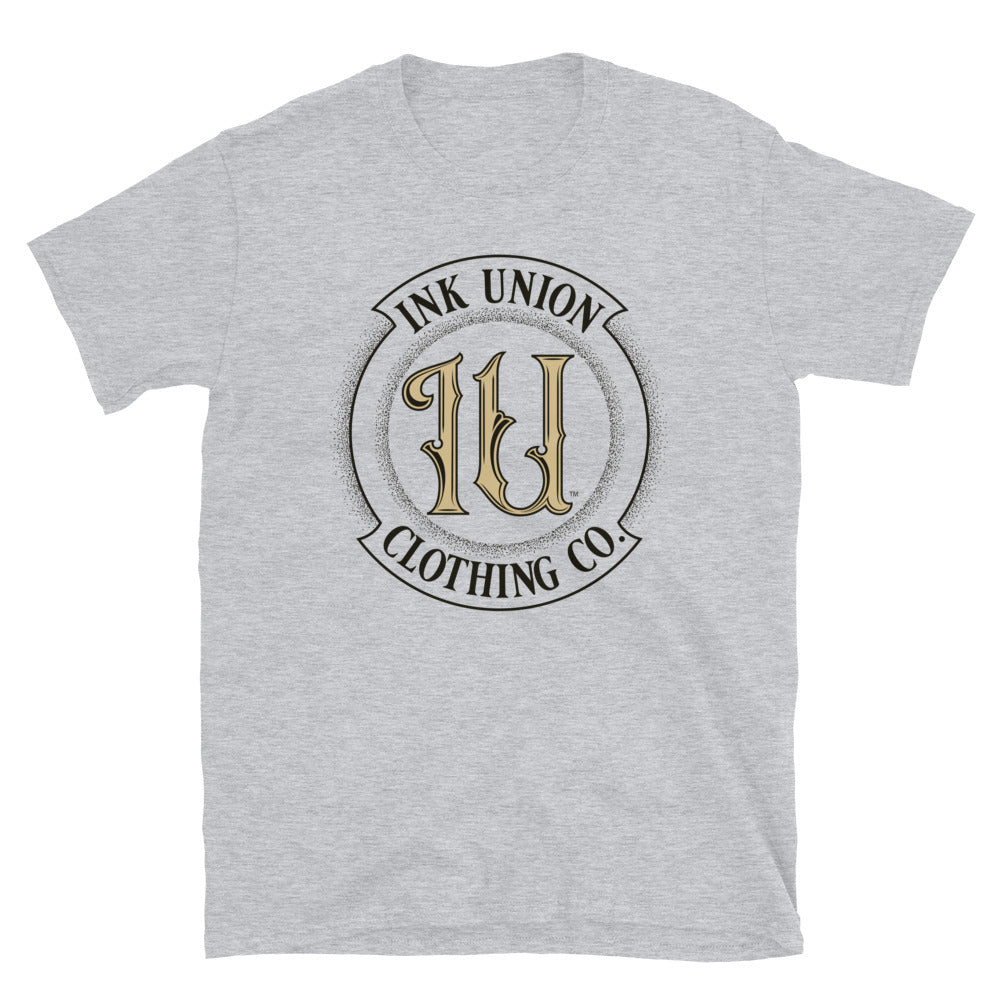 A light grey t-shirt with the Ink Union Clothing Co Badge logo in black and gold centered on the front of the shirt.