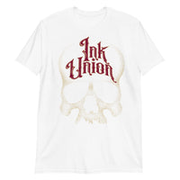 A white t-shirt adorned with a gold dot work human skull and the words Ink Union in fancy gold and red lettering across the forehead of the skull.