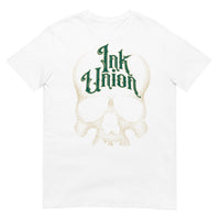 A white t-shirt adorned with a gold dot work human skull  and the words Ink Union in fancy gold and green lettering across the forehead of the skull.