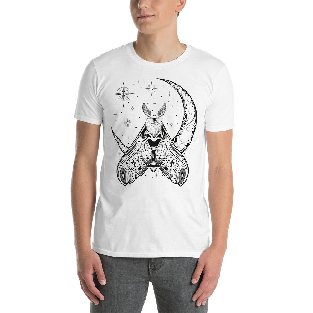 A man wearing a white t-shirt with a black crescent moon and stars with an ornate moth in front of the bottom of the moon facing upward.