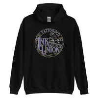 A black hoodie adorned with the Ink Union Tattoo Co. blue and gold with a silver tattoo machine logo.
