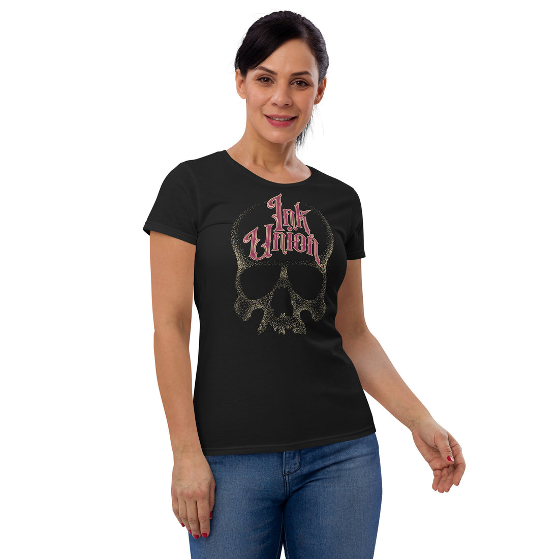 An attractive woman wearing a black t-shirt with a gold dot work human skull and the words Ink Union in fancy gold and red lettering across the forehead of the skull.