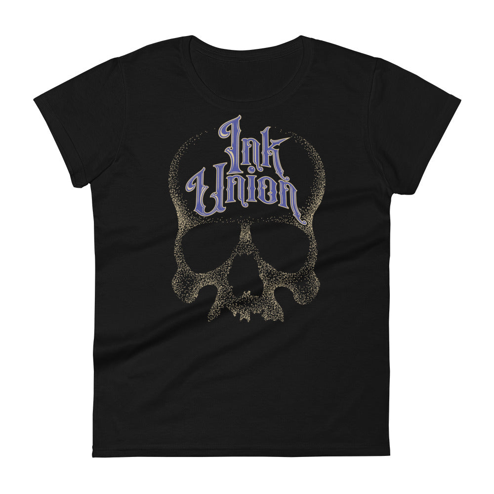 A black t-shirt background with a gold dot work human skull and the words Ink Union in fancy gold and blue lettering across the forehead of the skull.