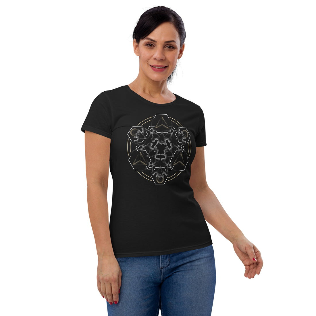 A woman wearing a black t-shirt with a mandala built from white dot work skulls and gold and white geometric shapes.