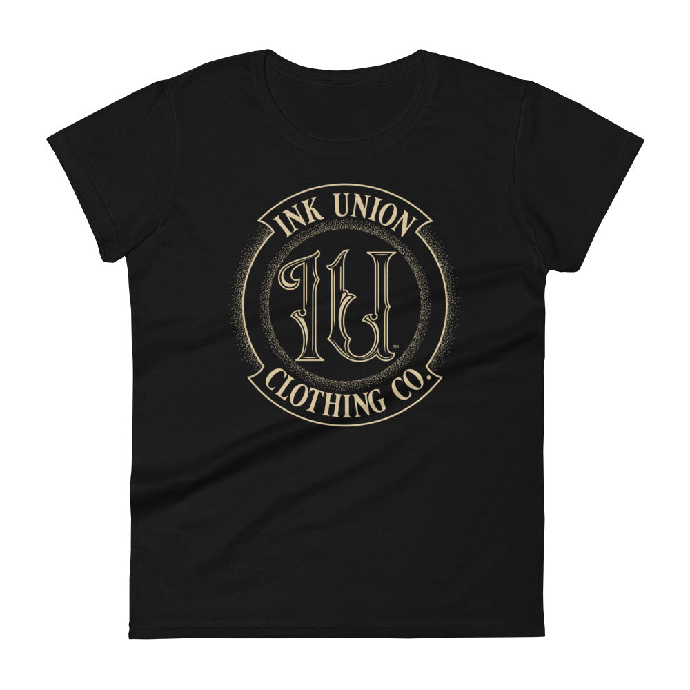 A black t-shirt adorned with the Ink Union Clothing Co gold badge logo containing fancy lettering and dot work gradients.