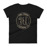 A black t-shirt adorned with the Ink Union Clothing Co gold badge logo containing fancy lettering and dot work gradients.