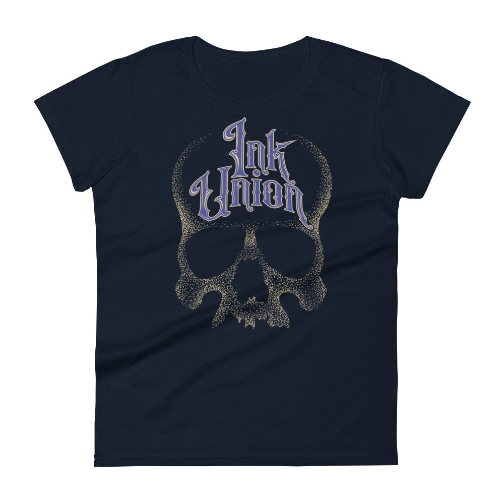A Navy t-shirt background with a gold dot work human skull and the words Ink Union in fancy gold and blue lettering across the forehead of the skull.
