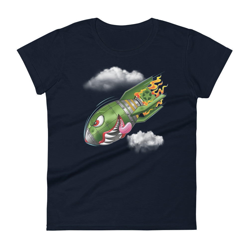 A navy blue t-shirt with a military green neo-traditional bomb tattoo design. The bomb is falling with a look of determination in its eyes, an evil toothy grin, and its tongue hanging out of its mouth. Flames are coming from the back of the bomb, and some clouds are in the background.