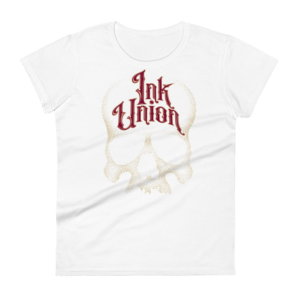 A white t-shirt adorned with a gold dot work human skull  and the words Ink Union in fancy gold and red lettering across the forehead of the skull.