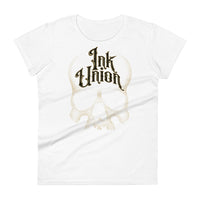 A white t-shirt adorned with a gold dot work human skull  and the words Ink Union in fancy gold and black lettering across the forehead of the skull.