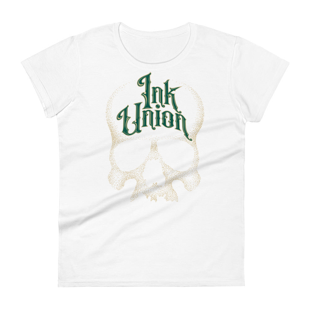 A white t-shirt adorned with a gold dot work human skull  and the words Ink Union in fancy gold and green lettering across the forehead of the skull.