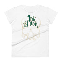 A white t-shirt adorned with a gold dot work human skull  and the words Ink Union in fancy gold and green lettering across the forehead of the skull.