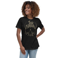 An attractive woman wearing a black t-shirt with a gold dot work human skull and the words Ink Union in fancy gold and black lettering across the forehead of the skull.