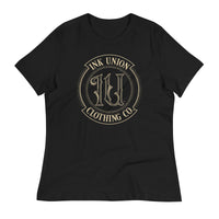 A black t-shirt adorned with the Ink Union Clothing Co gold badge logo containing fancy lettering and dot work gradients.