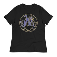 A black t-shirt with a gold circle containing fancy lettering in blue and gold that says Ink Union and a gold tattoo machine peeking out from behind on the right side.  There is a dot work gradient inside the circle, and the words Tattoo Co. in gold are at the bottom of the design.