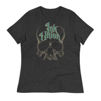 A dark grey t-shirt adorned with a gold dot work human skull  and the words Ink Union in fancy gold and green lettering across the forehead of the skull.