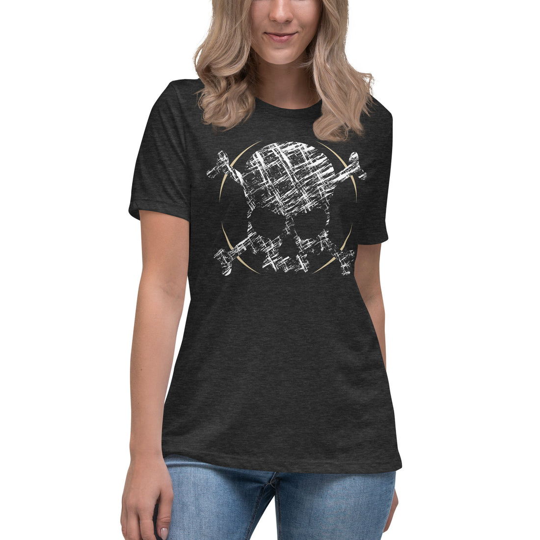 An attractive woman wearing a black t-shirt adorned with a roughly cross-hatched skull and crossbones in white.  Solid gold arcs give the image the impression of movement towards the end of the crossbones.