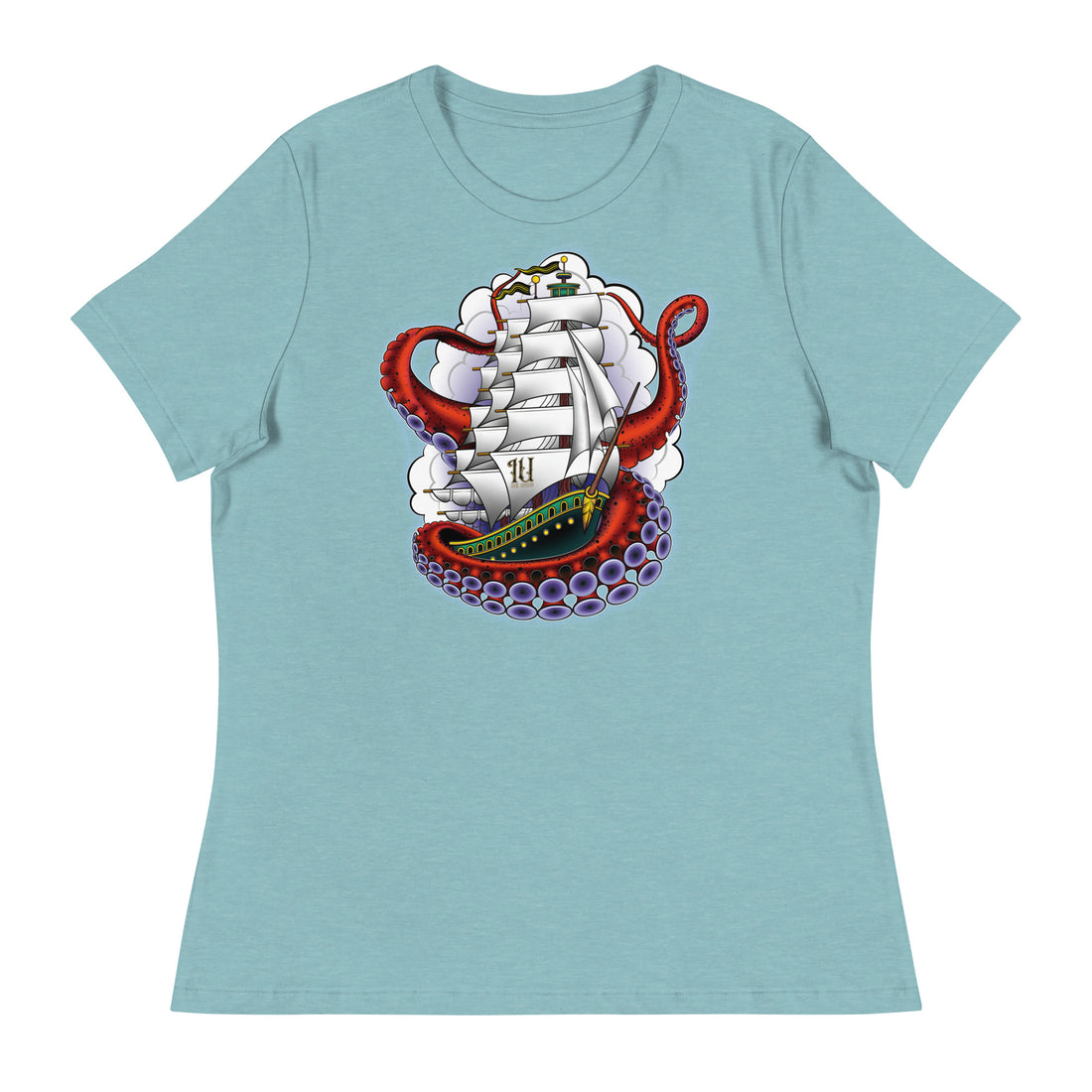 A light blue t-shirt with an old-school clipper ship tattoo design in green and brown with white sails surrounded by octopus tentacles in shades of red with purple tentacles. Behind the ship are purple-tinged clouds.