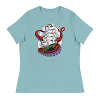 A light blue t-shirt with an old-school clipper ship tattoo design in green and brown with white sails surrounded by octopus tentacles in shades of red with purple tentacles. Behind the ship are purple-tinged clouds.
