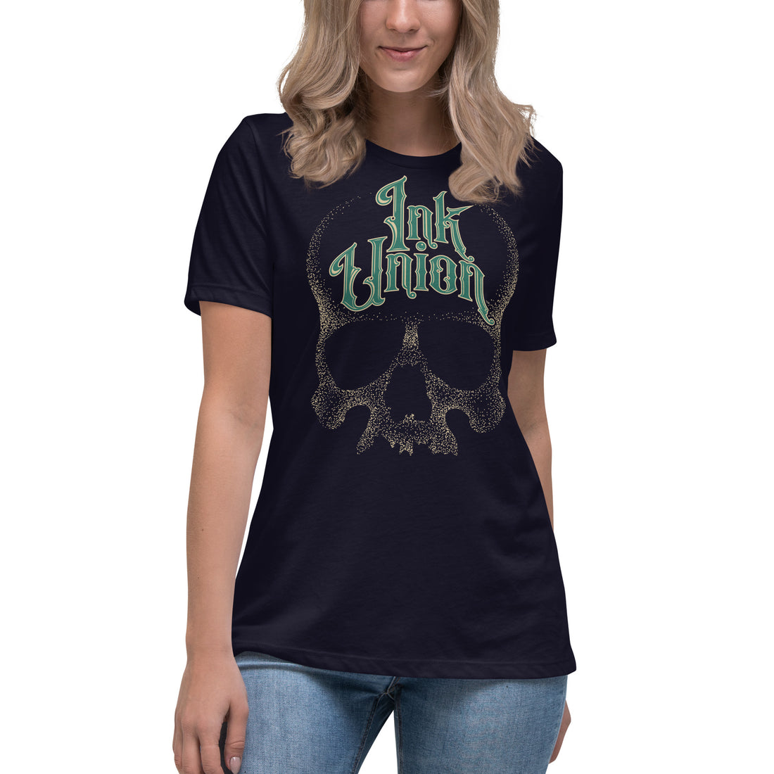 An attractive woman wearing a black t-shirt  adorned with a gold dot work human skull and the words Ink Union in fancy gold and green lettering across the forehead of the skull.