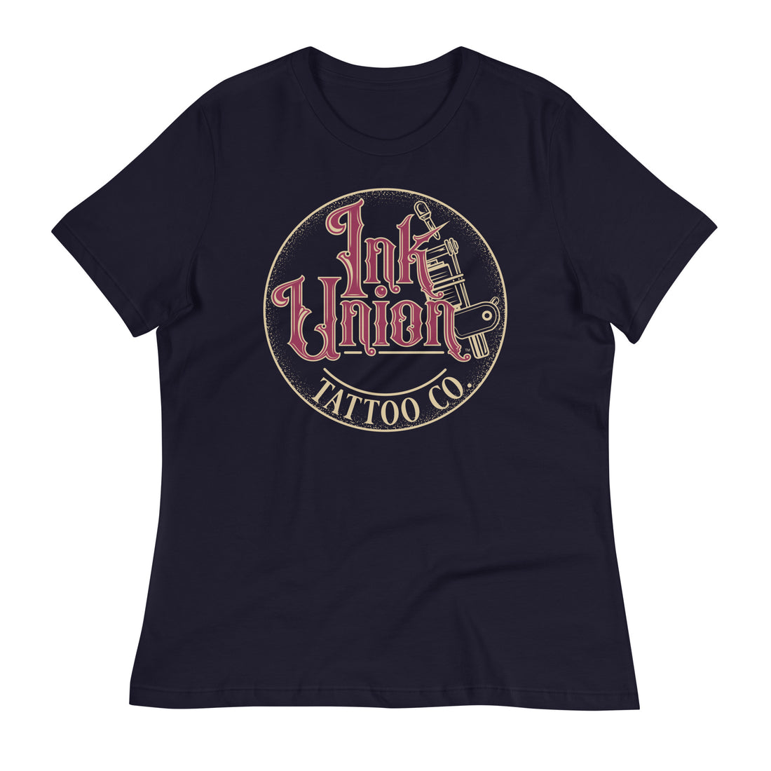 A navy blue t-shirt with a gold circle containing fancy lettering in red and gold that says Ink Union and a gold tattoo machine peeking out from behind on the right side.  There is a dot work gradient inside the circle, and the words Tattoo Co. in gold are at the bottom of the design.