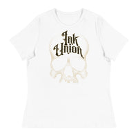 A white t-shirt adorned with a gold dot work human skull  and the words Ink Union in fancy gold and black lettering across the forehead of the skull.