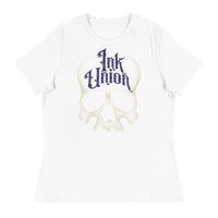 A white t-shirt adorned with a gold dot work human skull and the words Ink Union in fancy gold and blue lettering across the forehead of the skull.