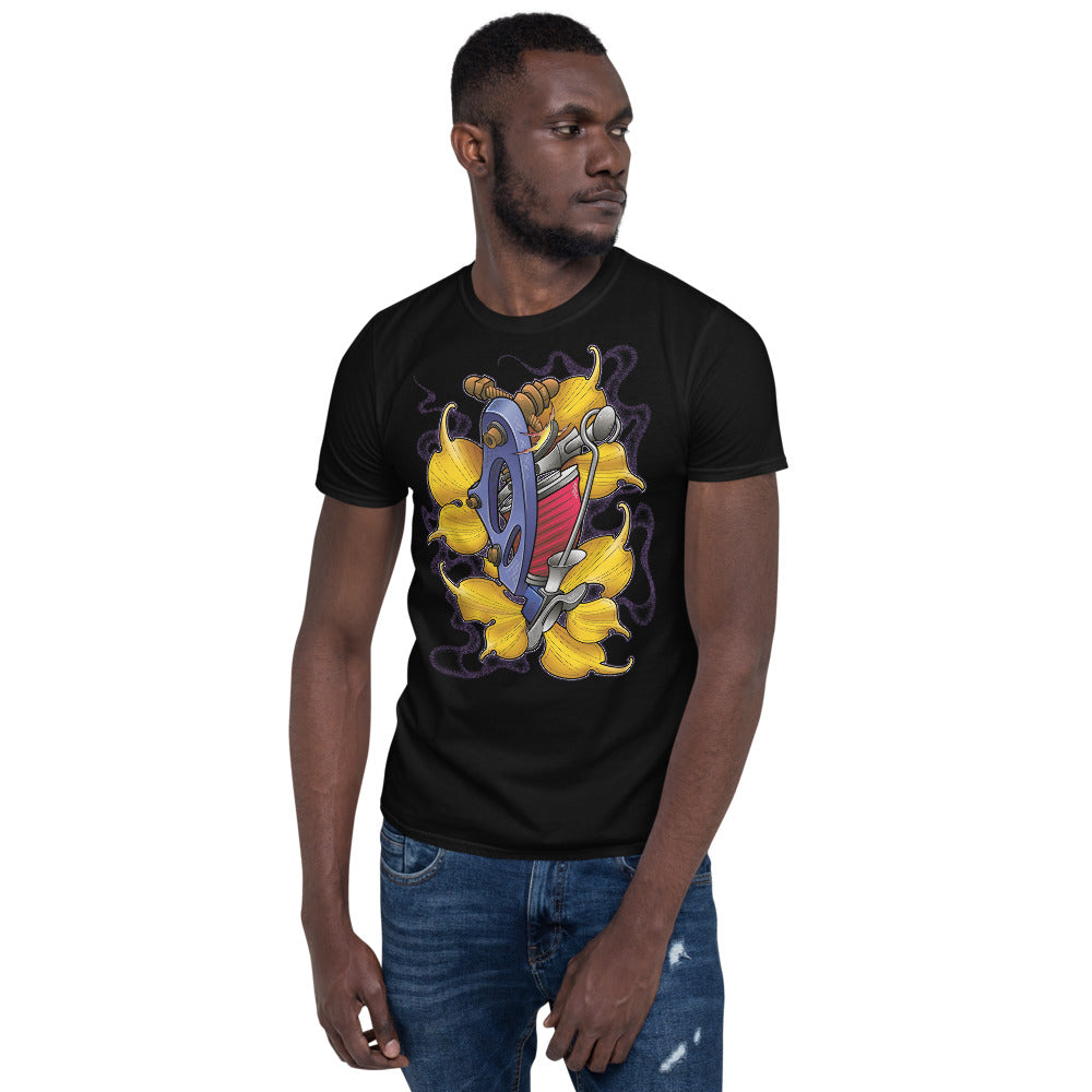 An attractive man wearing an ink union clothing co. black unisex t-shirt with a blue tattoo machine with red coils surrounded by gold ginkgo leaves and  wispy purple smoke