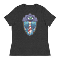 A dark grey t-shirt with an old school eye of the storm tattoo design of large dark purple storm clouds at the top of the design with a green eye in the middle of the clouds.  Below the clouds is an oval shape with brown rope. Inside the rope are stormy seas and lightning striking at a lighthouse that is white and red striped like a barber pole.