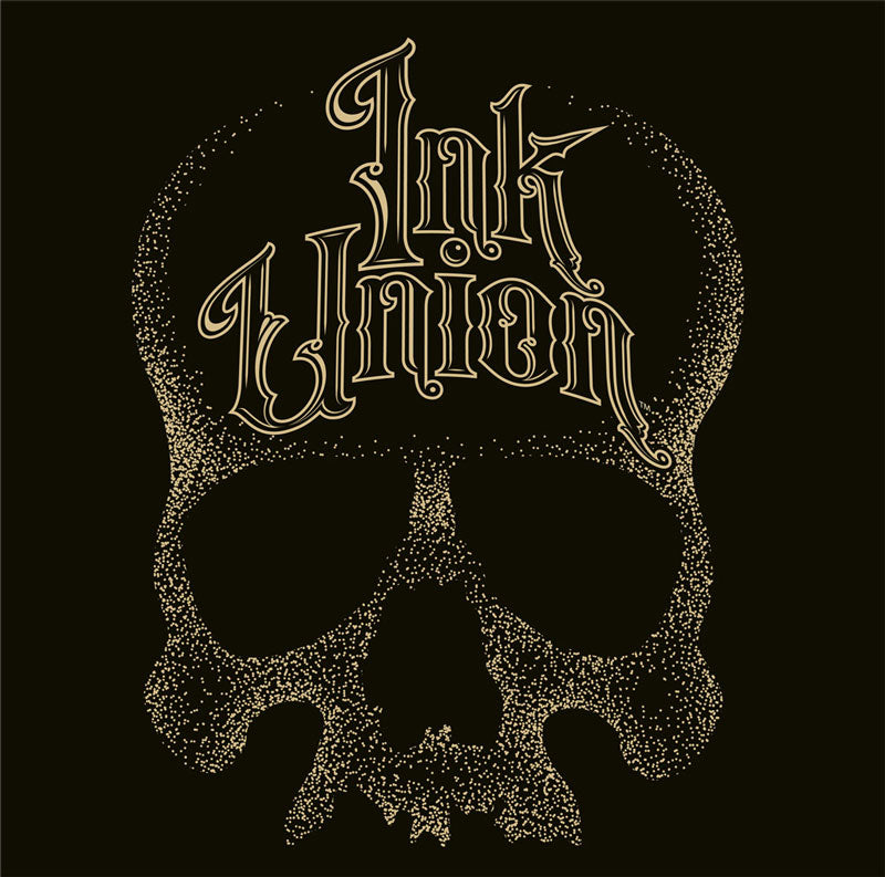 A square black background adorned with a gold dot work human skull and the words Ink Union in fancy gold and black lettering across the forehead of the skull.