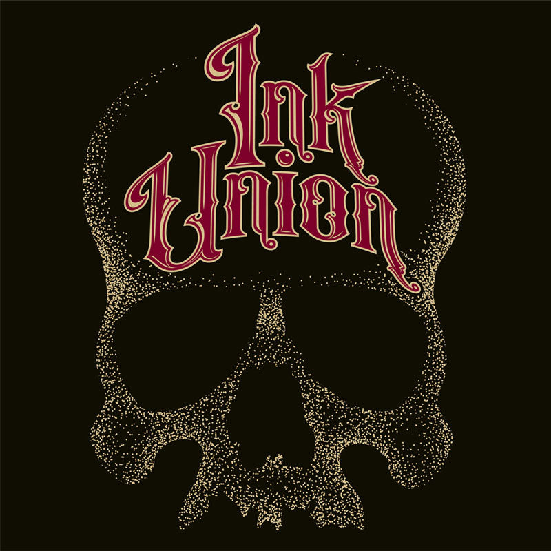 A black background with a gold dot work human skull and the words Ink Union in fancy gold and red lettering across the forehead of the skull.