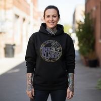 Tattooed female model wearing black Ink Union Tattoo Co. blue script tattoo machine graphic hoodie — alternative streetwear, tattoo artist sweatshirt, unisex heavy blend hoodie, edgy cool fashion

