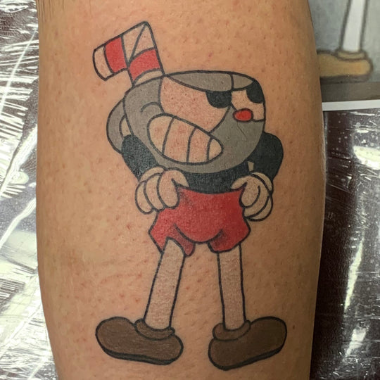 color tattoo of cuphead a character from the videogame cuphead