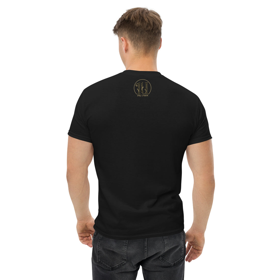 The back view is of an attractive man wearing a black t-shirt with a small gold and black Ink Union ring Logo centered just under the neckline.