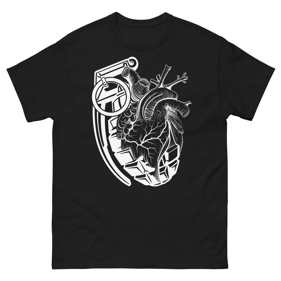 A black t-shirt with a white grenade of sold color and line work morphing into an anatomical heart drawn using line work for shading at the top right of the image.