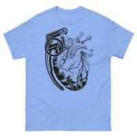 A Carolina bluet-shirt with a black grenade of sold color and line work morphing into an anatomical heart drawn using line work and hatching for shading at the top right of the image.
