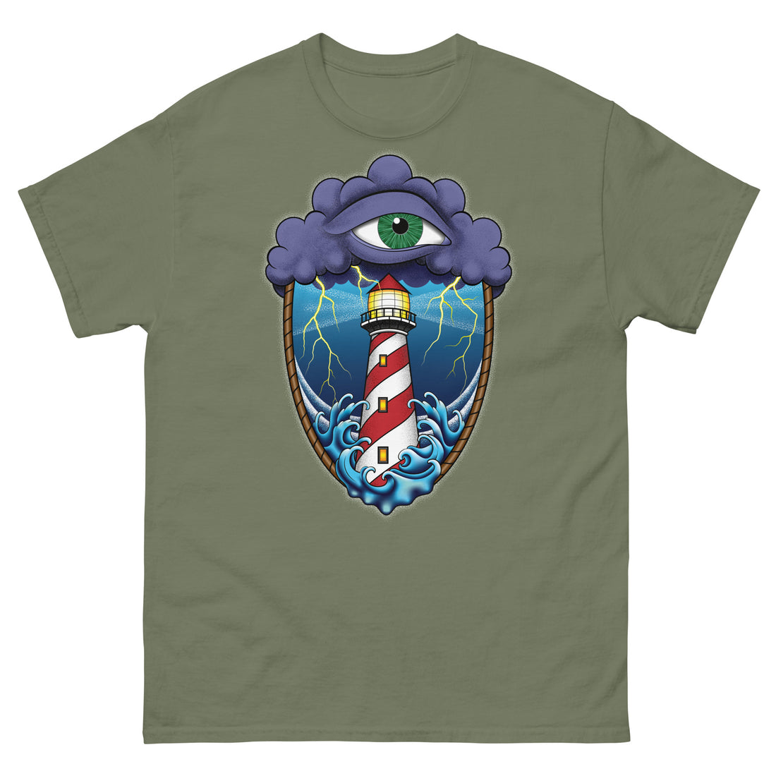 A olive green t-shirt with an old school eye of the storm tattoo design of large dark purple storm clouds at the top of the design with a green eye in the middle of the clouds.  Below the clouds is an oval shape with brown rope. Inside the rope are stormy seas and a lighthouse with lightning striking in the background.  At the bottom of the design, some of the waves are spilling out of the rope barrier. The sky and seas are hues of blue; the lighthouse is white and red striped like a barber pole.